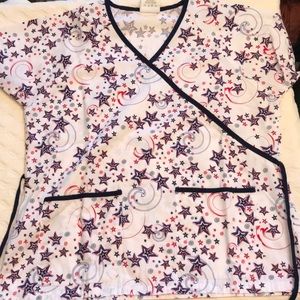 1 scrub top; brand is Happy Scrubs